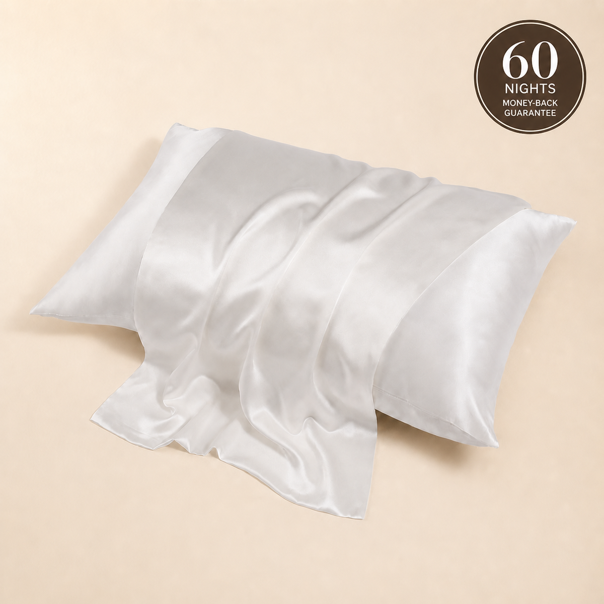 Two matching BodyComfortCo silk pillowcases shown as a practical bed-and-wash-day rotation with the current 60-night guarantee.