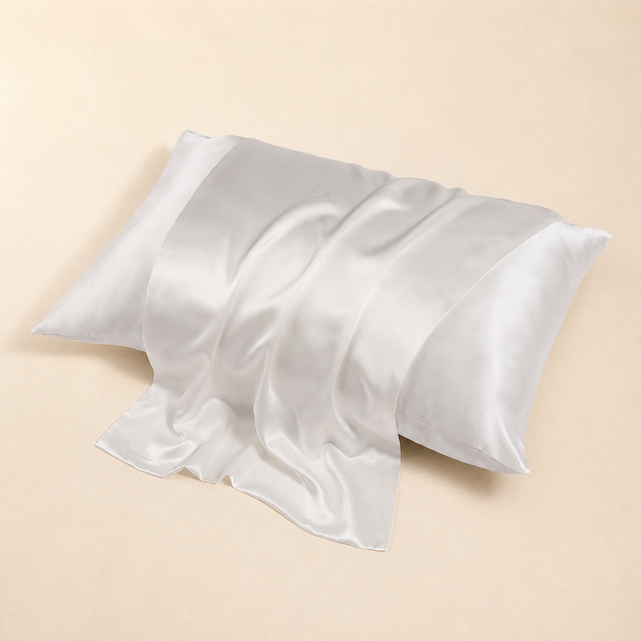 Apricot BodyComfortCo mulberry silk pillowcase on a warm cream background.